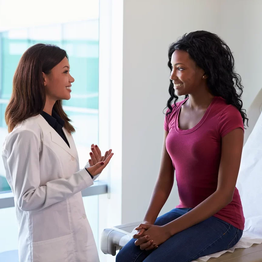 Women Health: Femate doctor meeting with female patient to discuss her health needs.