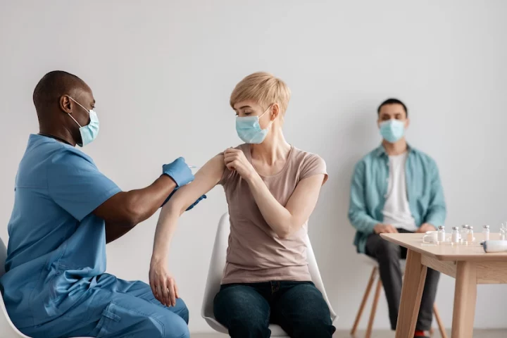 Patient getting vaccinated from the yellow and q fever at bardon rainword medical centre based in brisbane